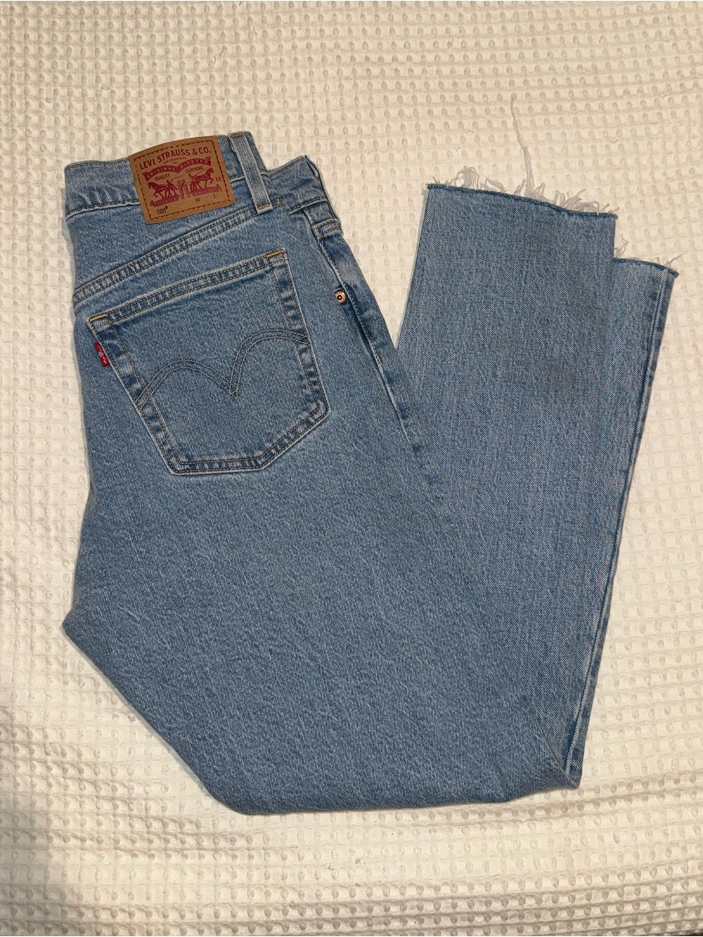 Vintage Levi's Light Blue High-Rise Straight Jeans with Raw Hem